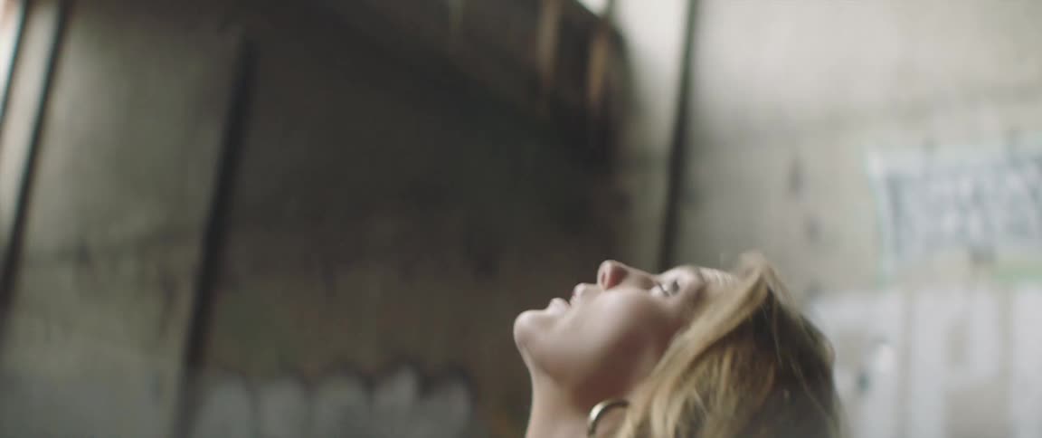 A woman looks around the empty building