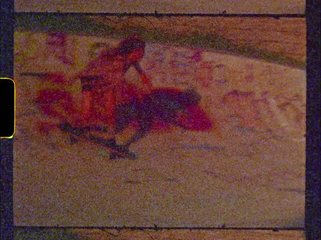 Vintage footage of a girl skateboarding at a skatepark covered with graffiti