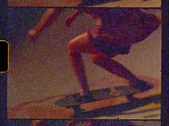 Vintage footage of a woman skateboarding at a skate park