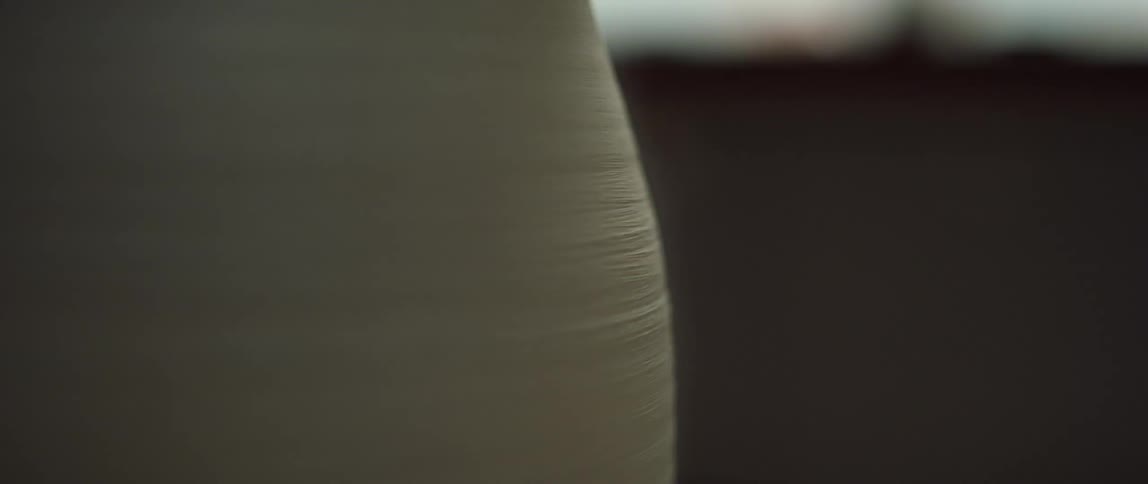 The pottery is spinning on the table
