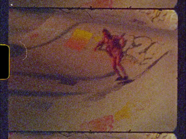 Female skateboarders ride skateboard through skate park bowl decorated with graffiti