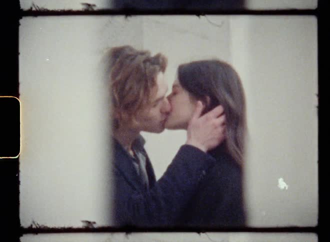 Film footage of a boyfriend and girlfriend are kissing