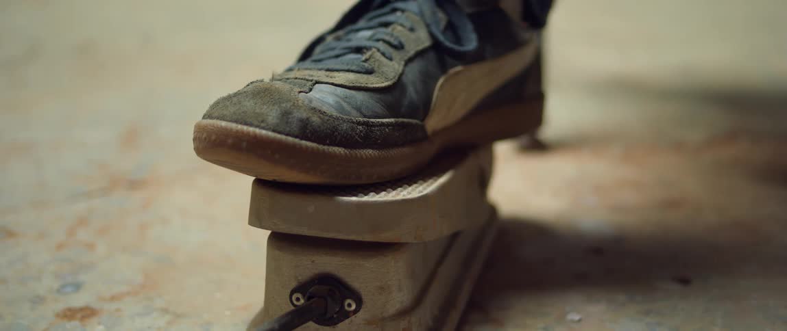 A person slowly presses the pedal