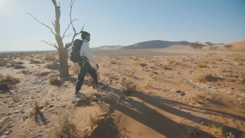 A woman hiking through the desert