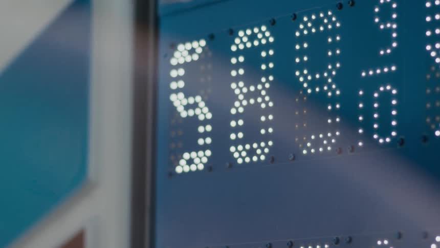 A digital sign displays a price of 589 and 9 10ths