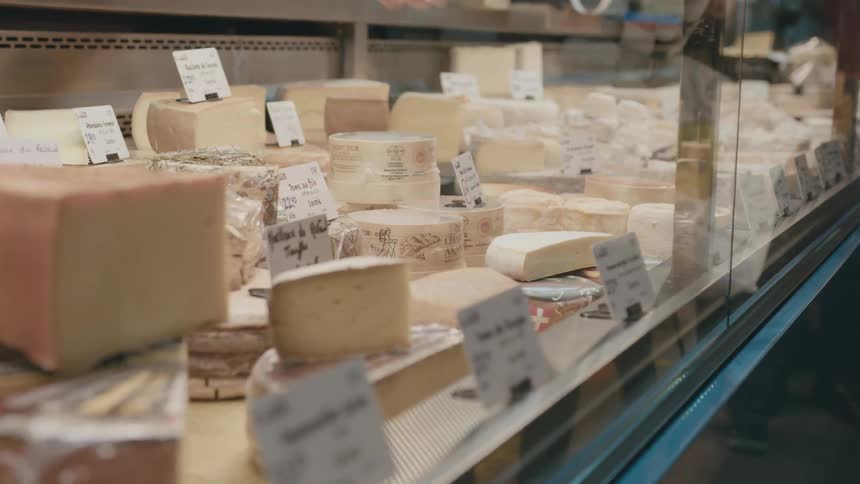 People are shopping for cheese