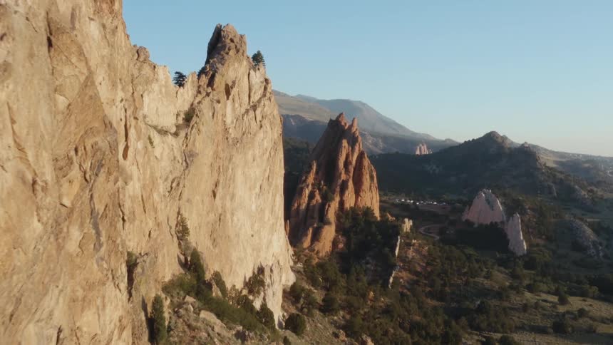 Mountains with rough peaks and mountains on the horizon under a clear blue sky