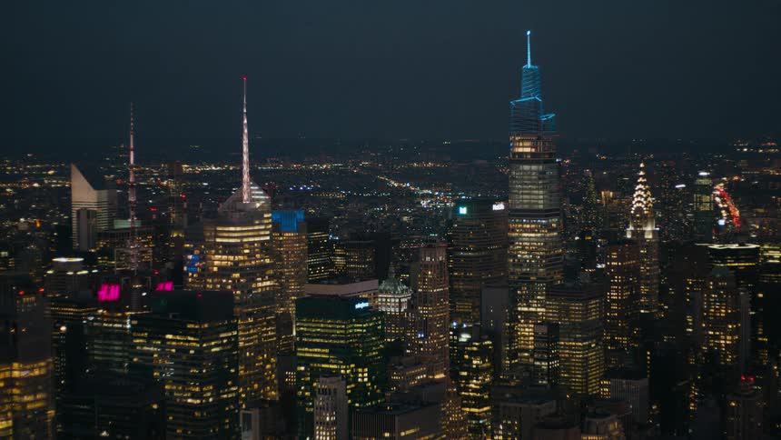 The sun sets on skyscrapers in a metropolis