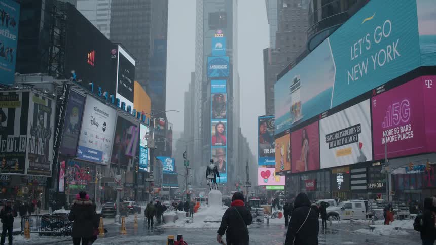 People walking around in a city during the winter
