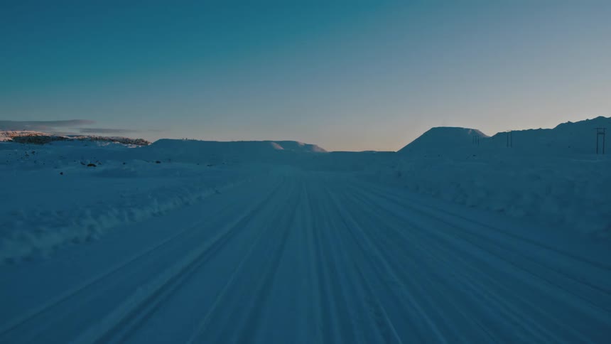 The road and field is covered with snow