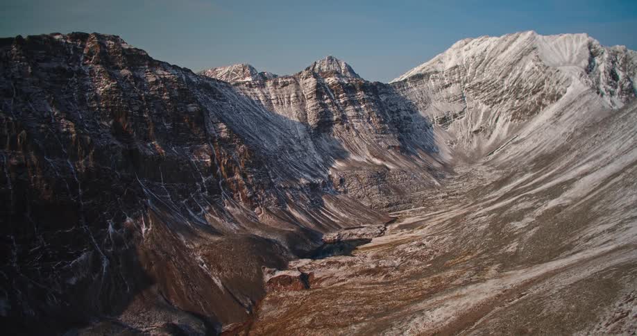 Mountain ridge with peaks high in a clear sky