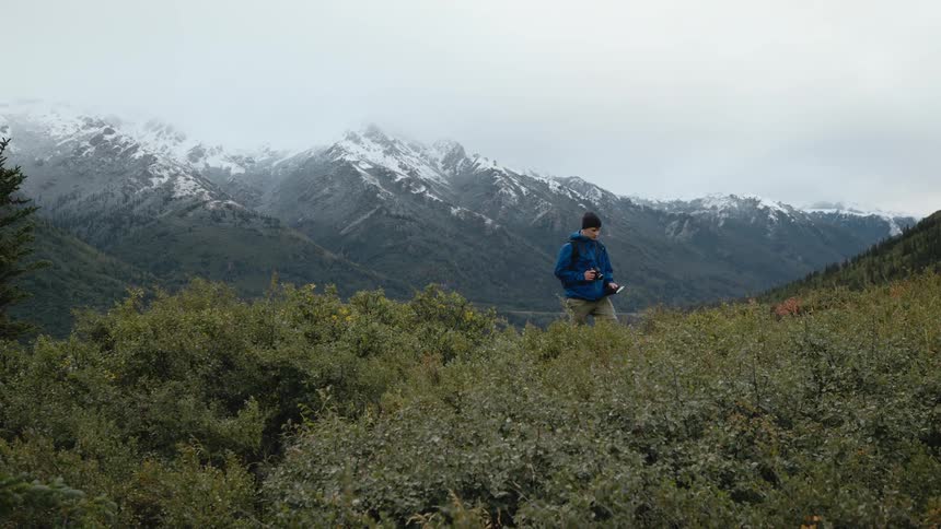 A man is hiking on the mountain