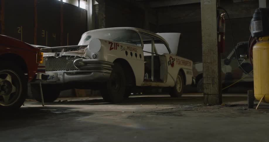 An old car in is a garage being restored