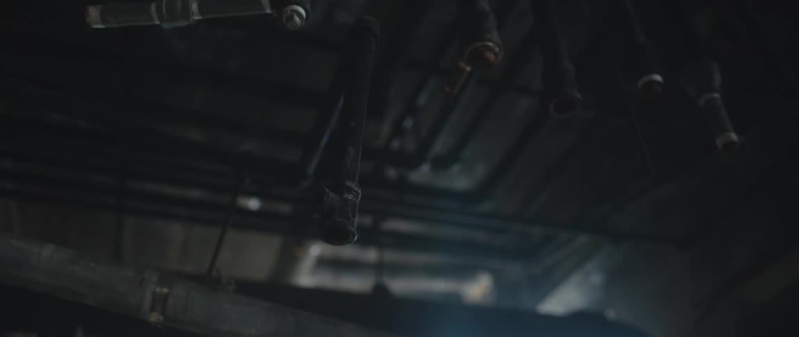 The pipes are hanging from the ceiling