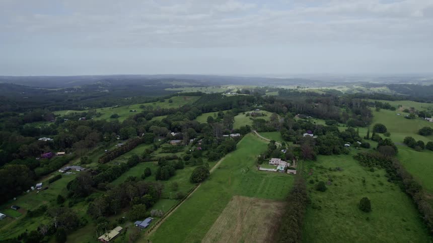 Aerial view of green countryside with houses