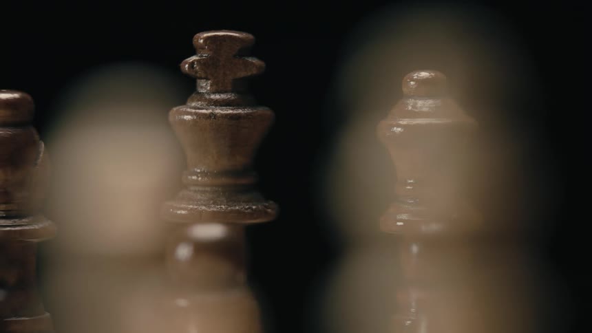 Close up view of wooden chess pieces
