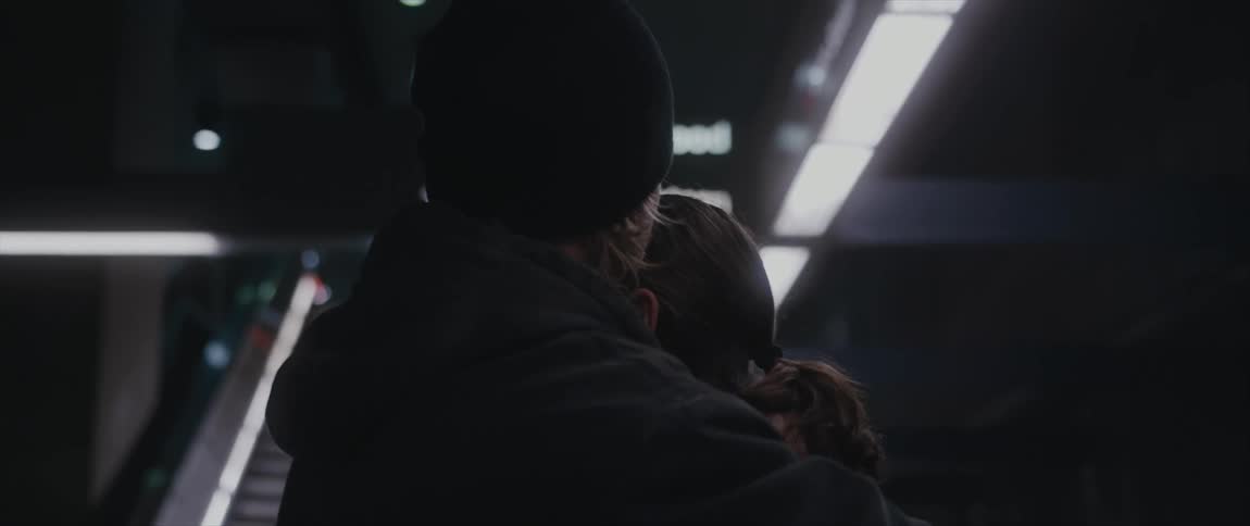 A man and woman are hugging