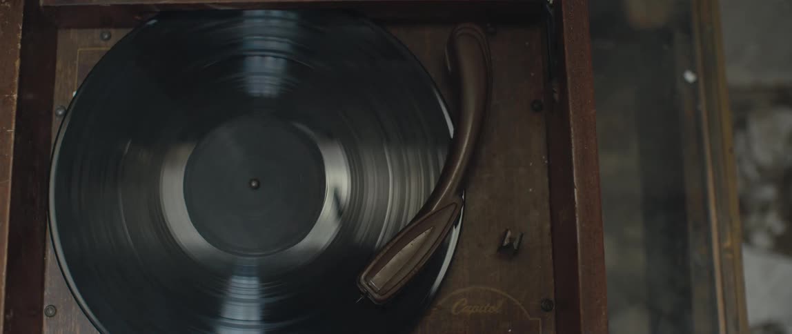 Close up of a vinyl record spinning on a vintage record player phonograph