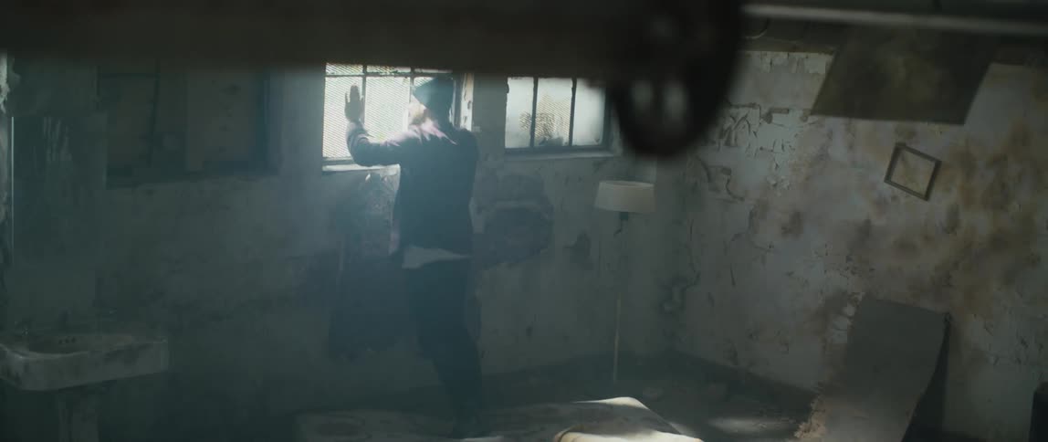 A man yells after walking into a squatters dirty apartment and hits the windows
