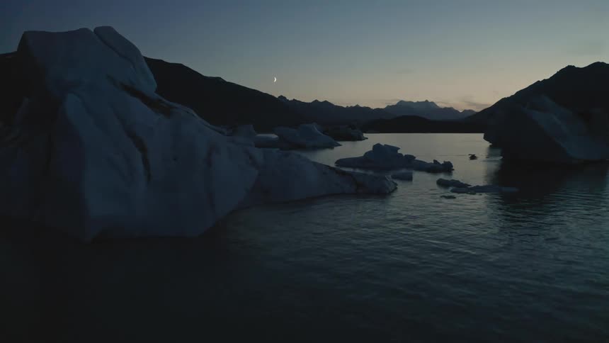 An aerial view of a lake with ice in it