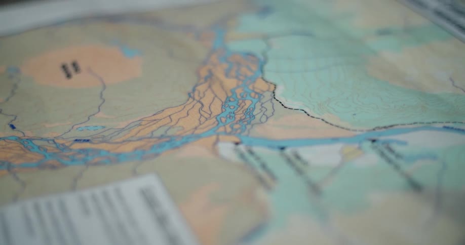 Book page shows map ofland with complex waterways and descriptive text