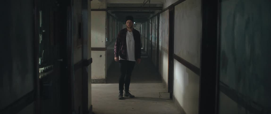 A view of a person walking into a hallway