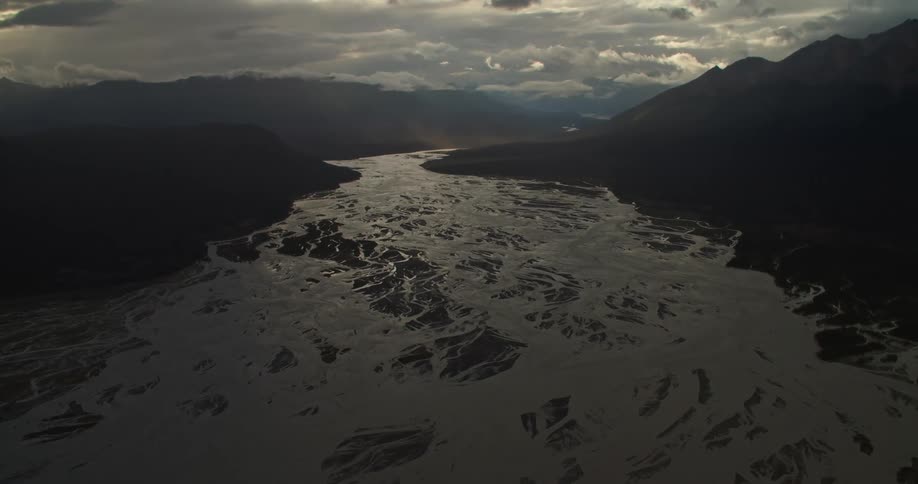Frozen river stretches to the horizon on dim cloudy day