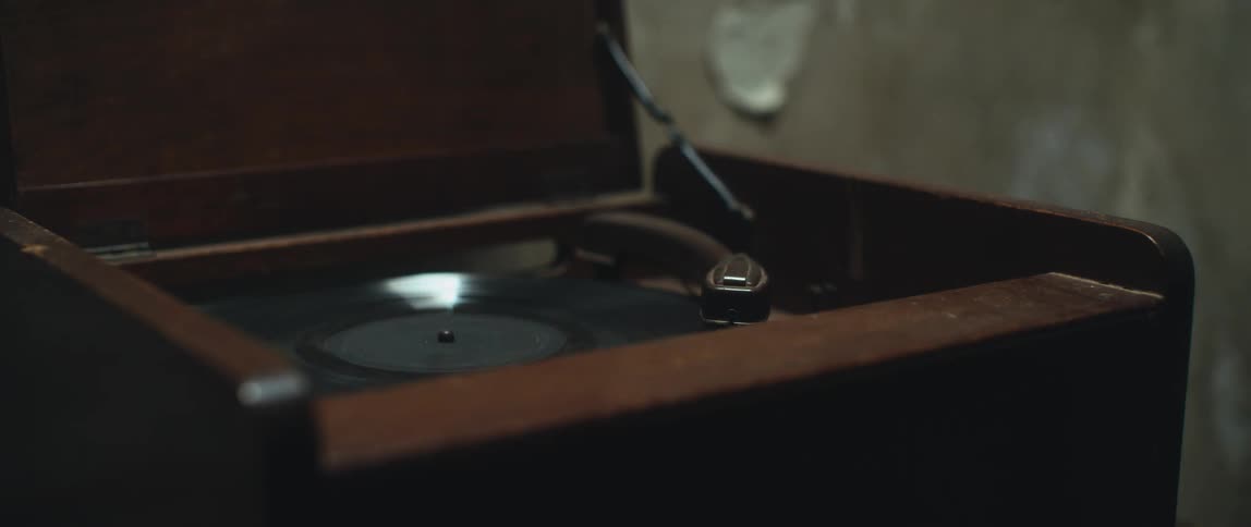 A person using a record player