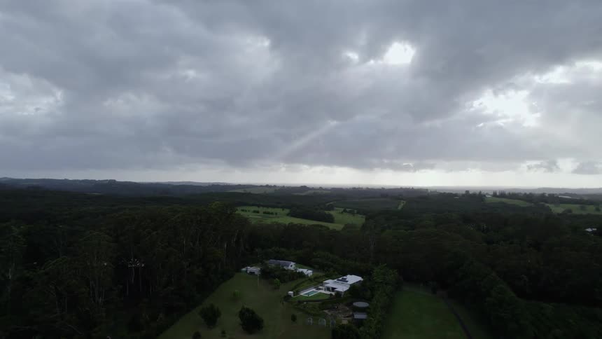 Massive homes sit far apart on land surrounded by trees