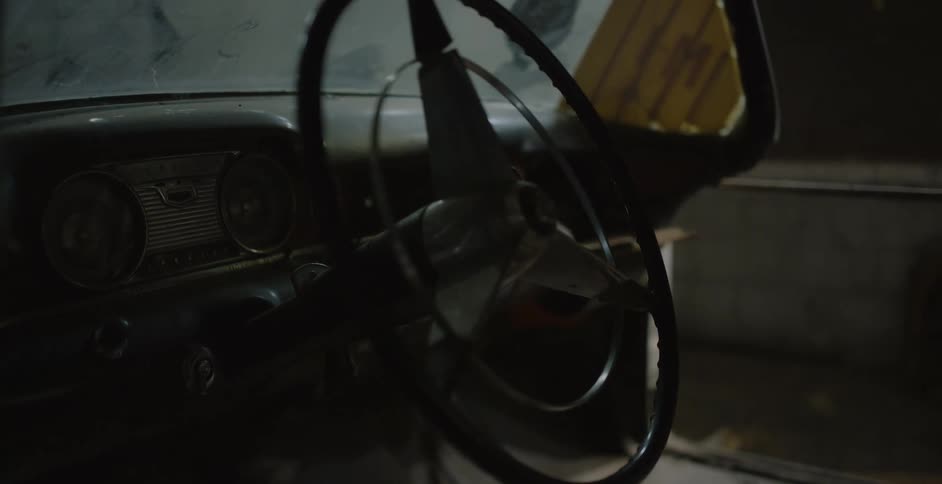 Old classic car steering wheel with dashboard