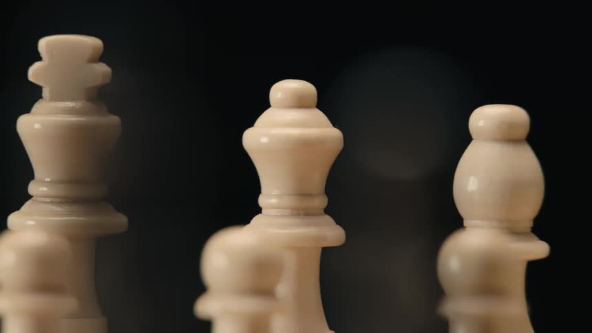 Various white chess pieces on display