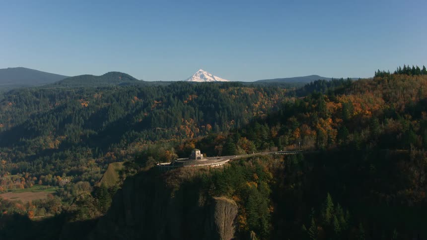 A car drives on the road on the mountain