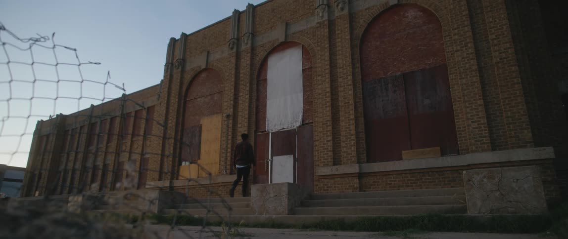 A homeless man walking to a shelter