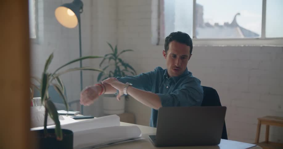 An employee sitting at a desk in an office