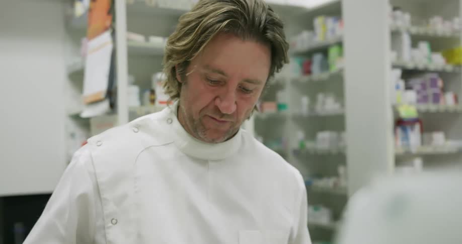 A pharmacist works in a pharmacy
