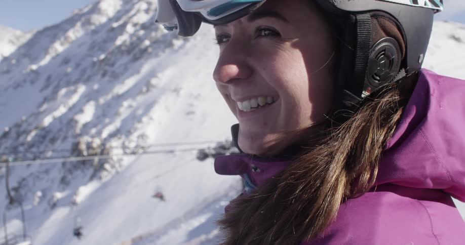A woman smiling at a ski resort