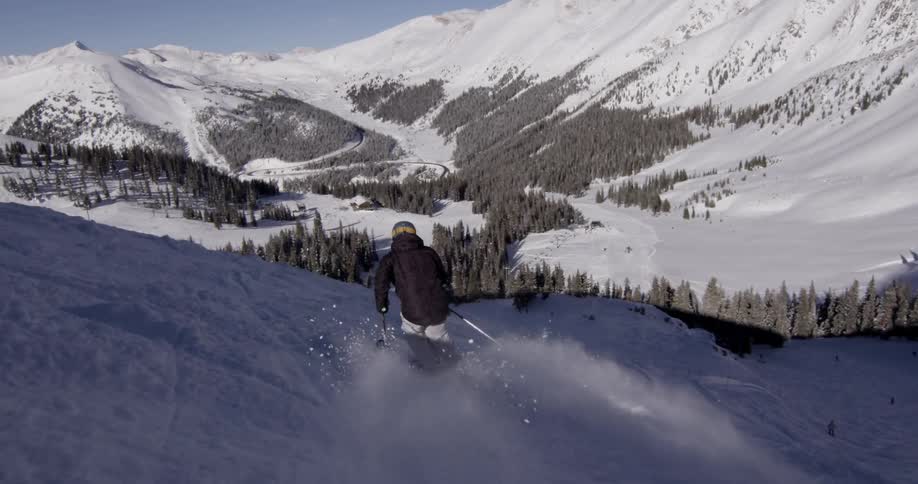 A man is skiing down a mountain