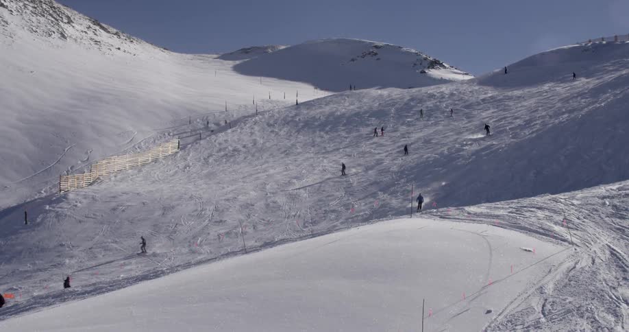 People skiing down a ski slope
