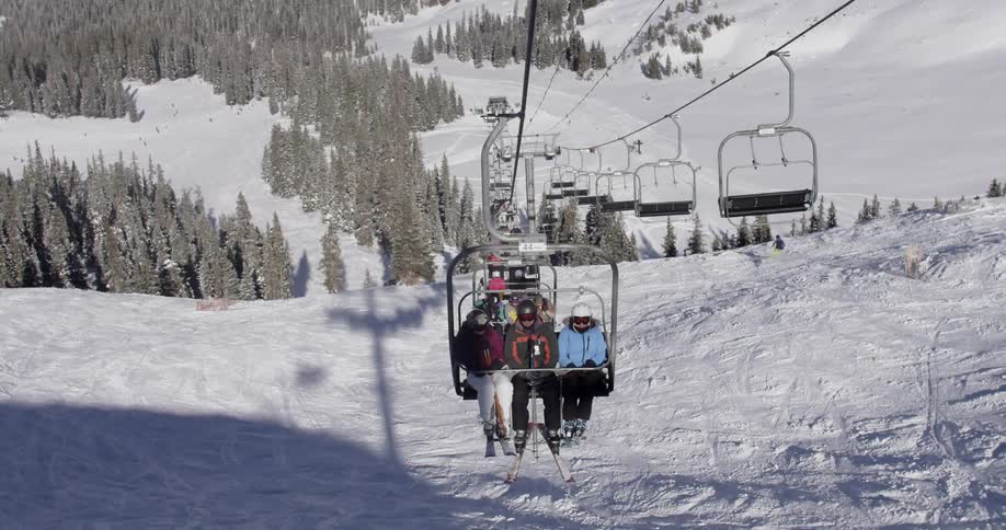 People are riding on a ski lift