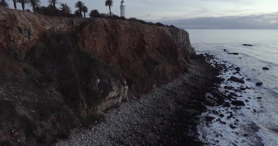 Aerial view of a lighthouse on a cliffside