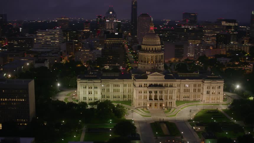 The buildings are lit in the city