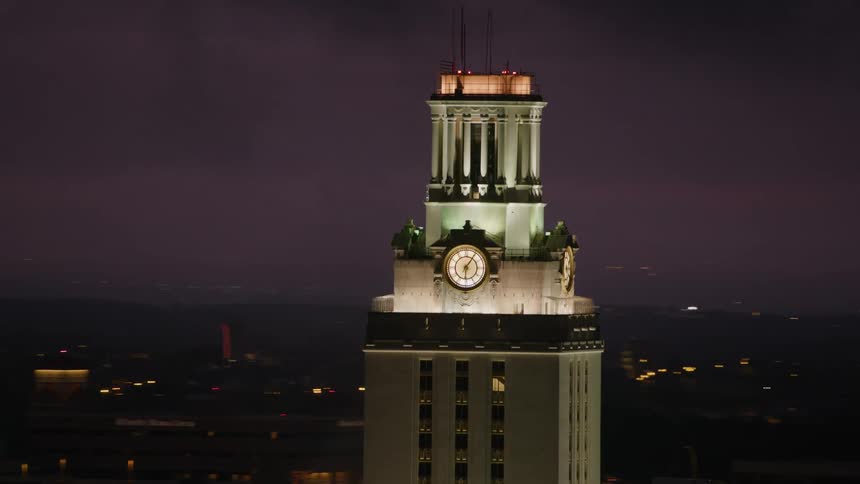 Aerial view of illuminated clock tower in the city