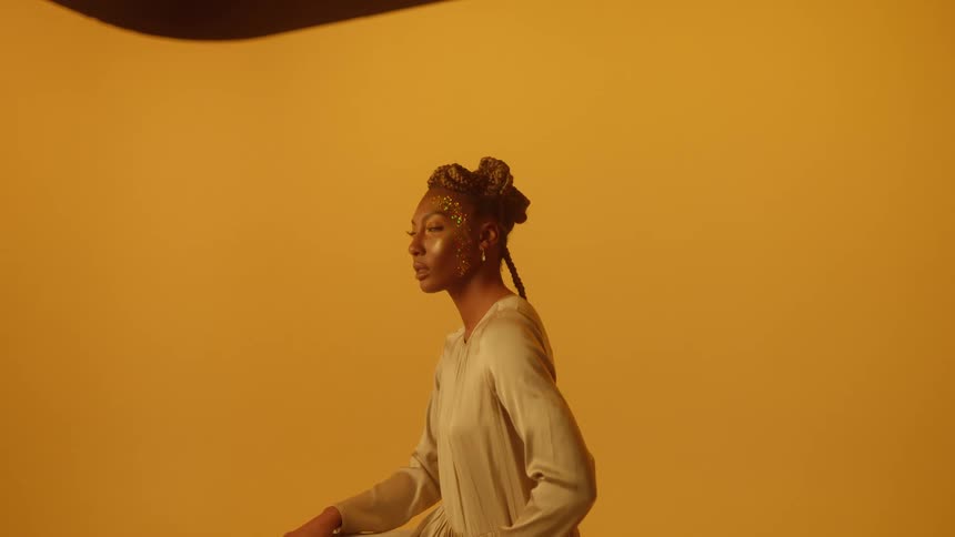 A woman slowly turns her head