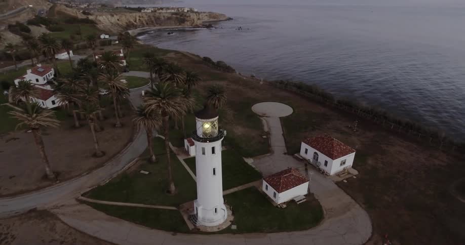 Aerial view of a lighthouse and ocean shore