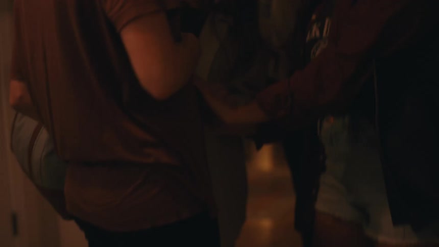 Friends greet each other at the door