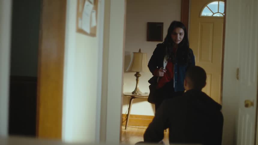 A woman storms out of the house during an argument with her boyfriend