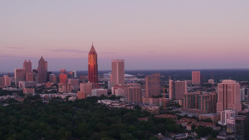 An aerial view of a city at sunset