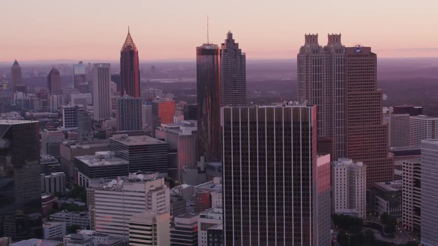 Aerial view of a downtown city is displayed at dusk