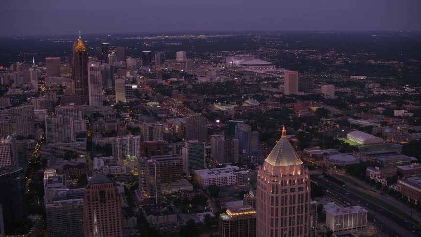 A skyscraper in a metropolis at night