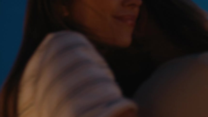 Close up of happy couple hugging and dancing outdoors at night